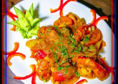 Curry dish decorated with various red chillies